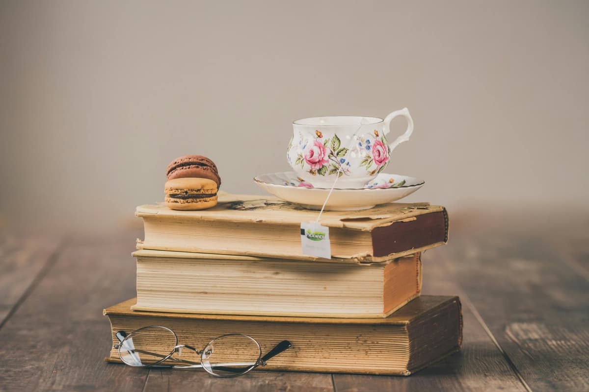 A teacup resting on a stack of books